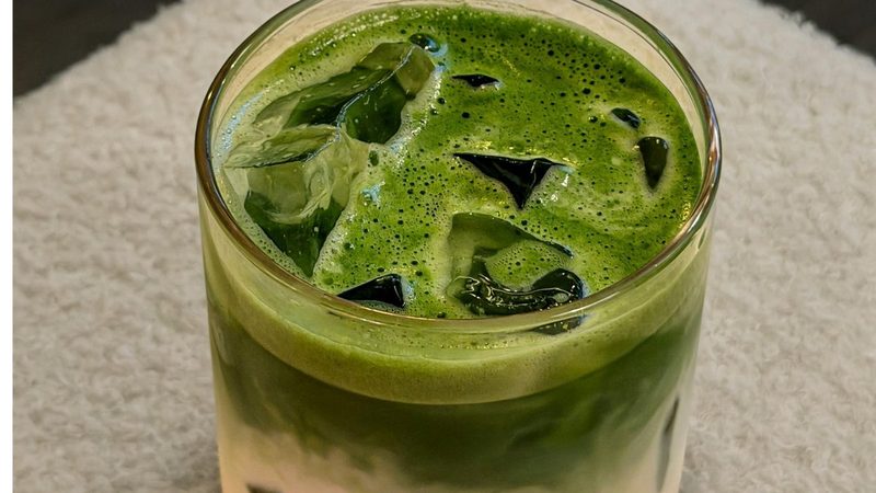 An iced matcha latte in a glass