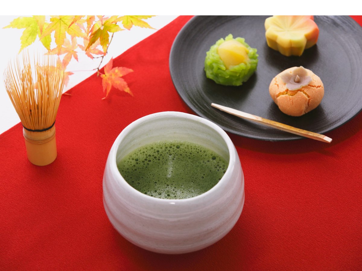 A golden cup of brewed genmaicha tea
