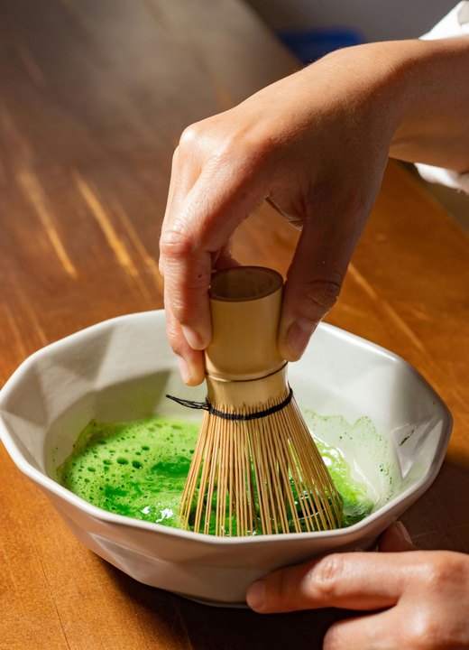 Whisking matcha in a bowl